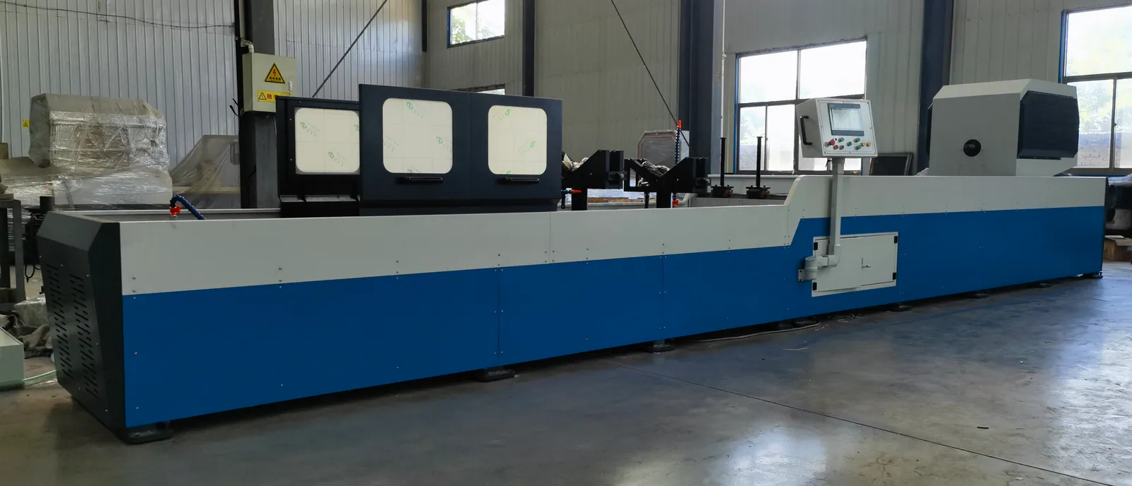 Blue and white custom deep-hole machine photographed in a Guanghe workshop