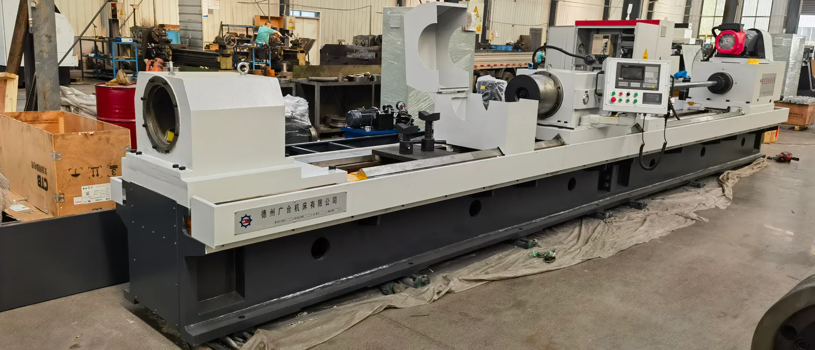 Front-right workshop view of a Guanghe CNC skiving and roller burnishing machine
