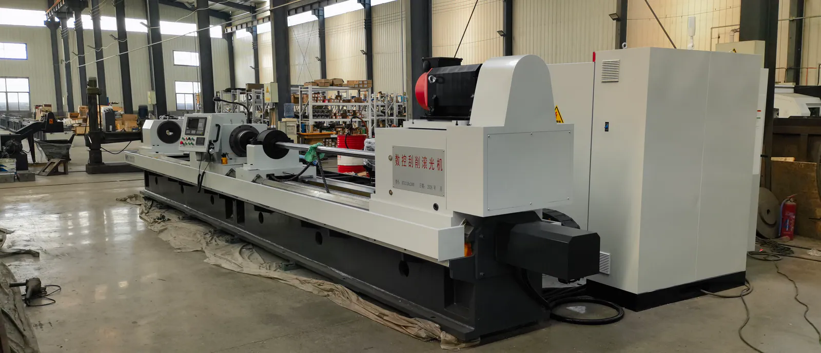 Rear-right workshop view of a CNC skiving and roller burnishing machine